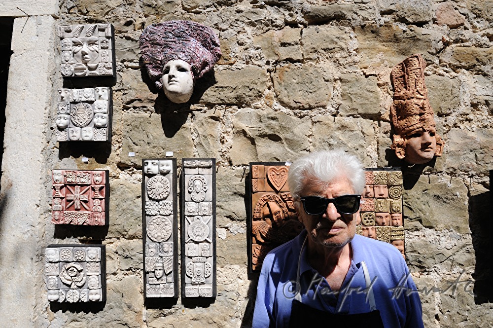artist with ceramics art work