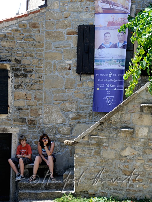 tourists rest on a bench