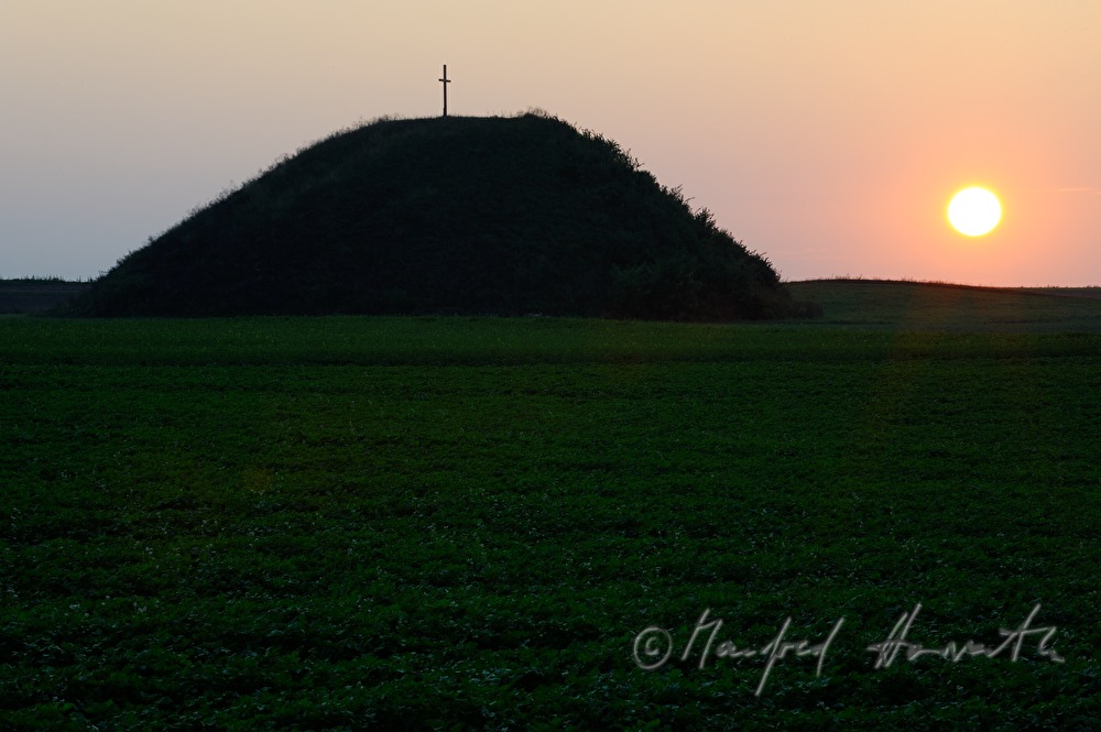 prehistoric tumulus in a field