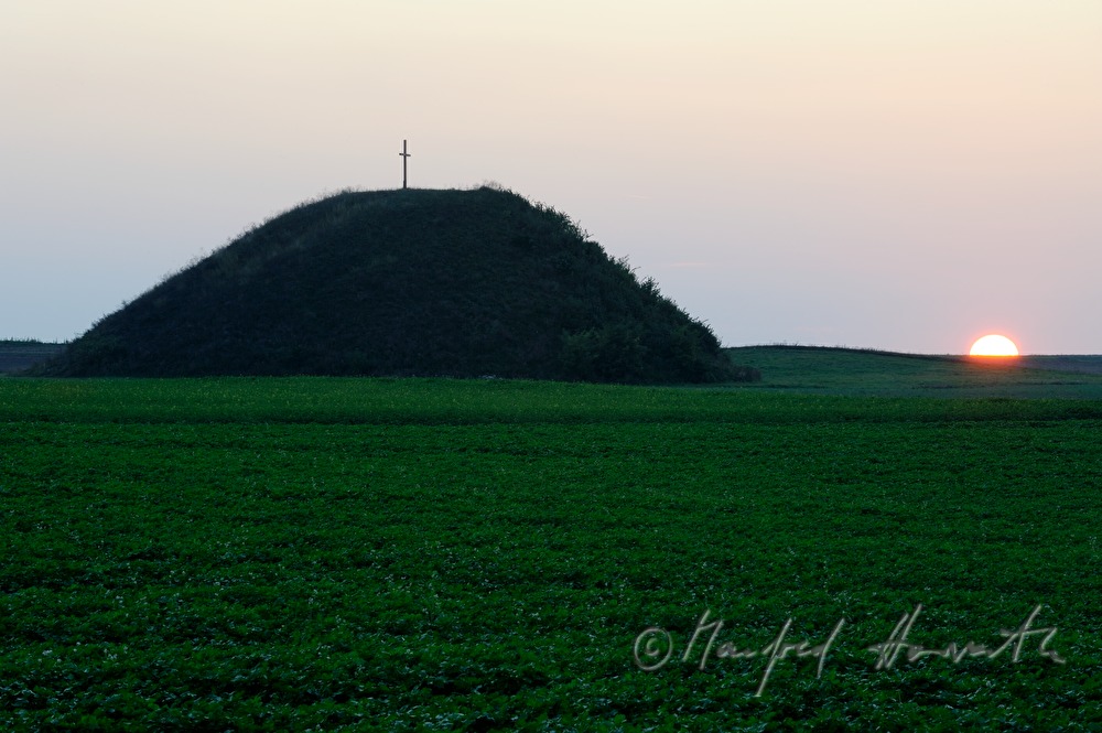 prehistoric tumulus in a field