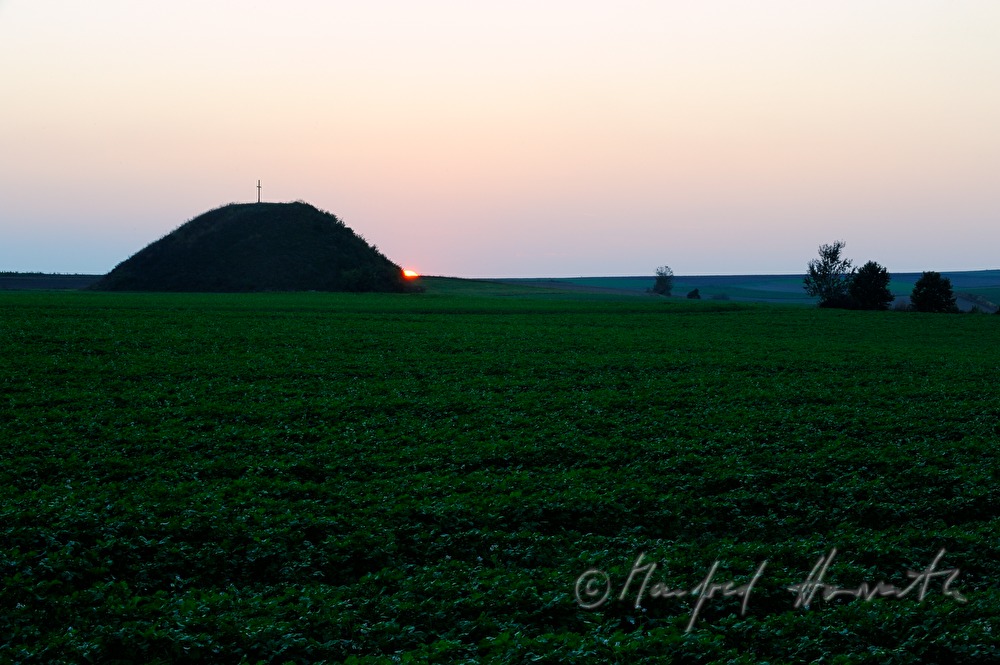 prehistoric tumulus in a field