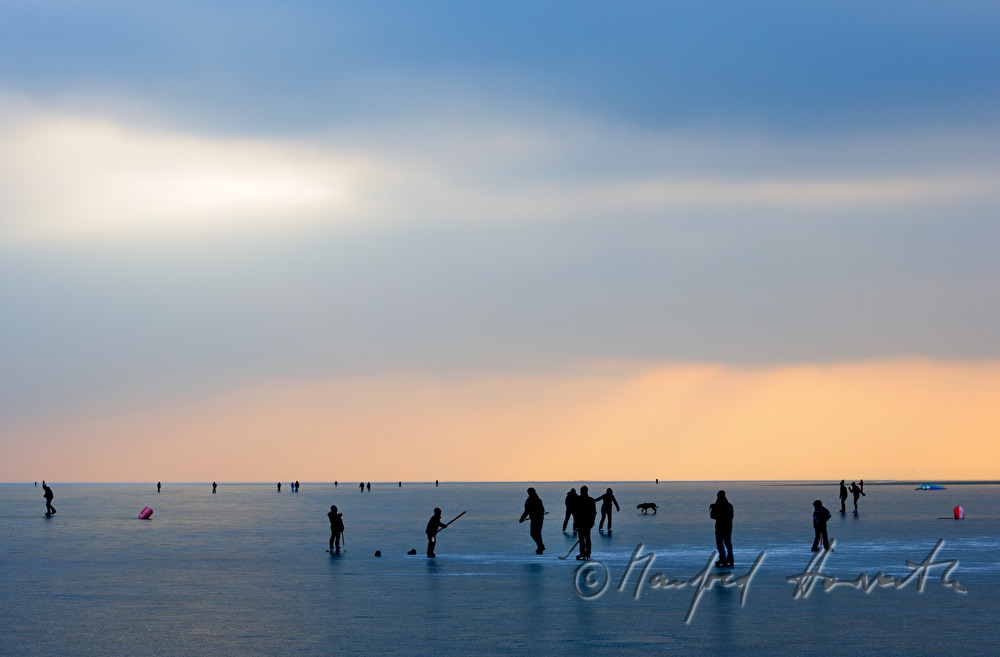 pontoon and ice skaters at sunset