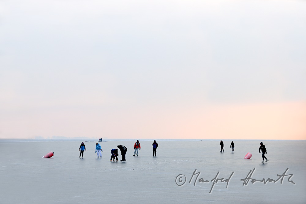 icebound buoys and ice skaters