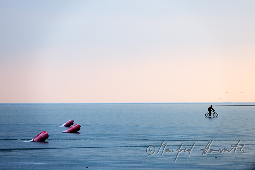 icebound buoys and bicyclist