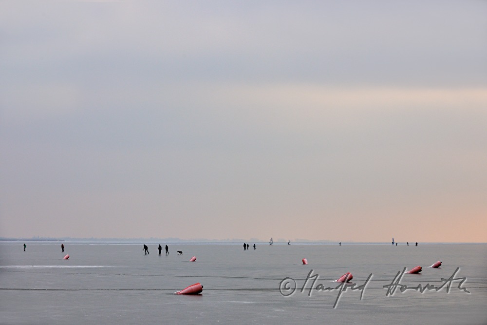 icebound buoys and ice skaters