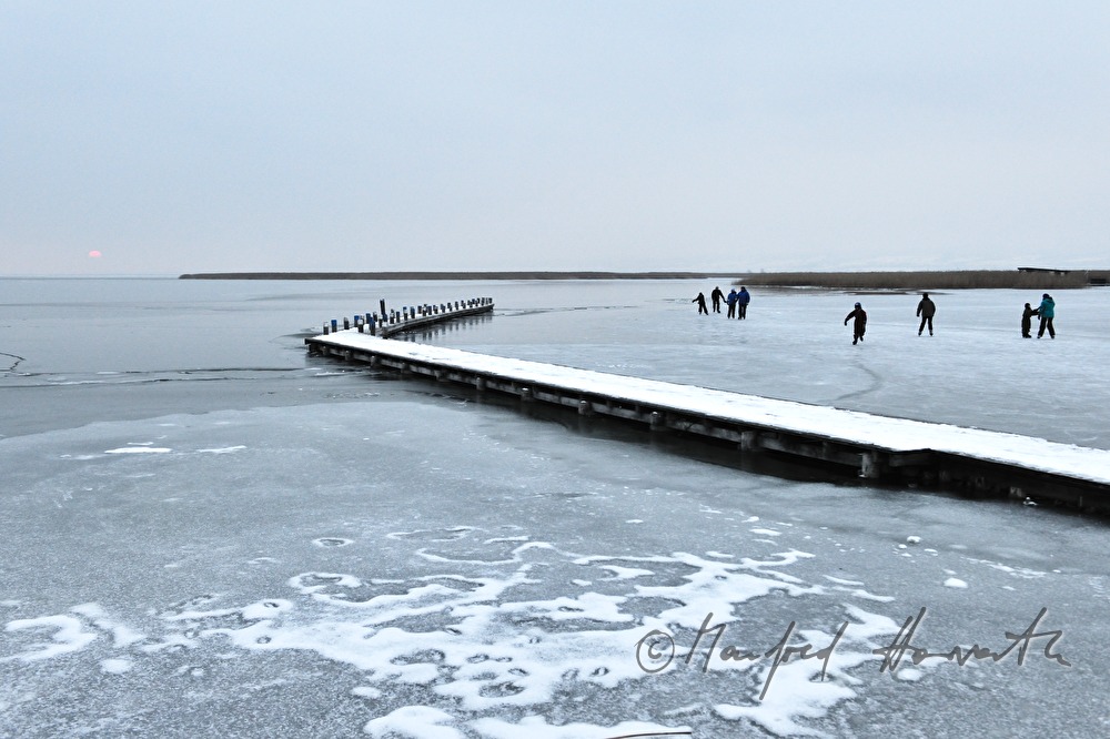 pontoon and ice skaters at sunset
