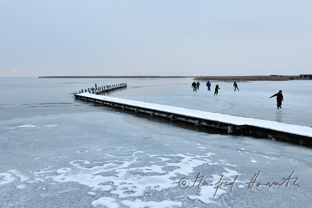 pontoon and ice skaters at sunset