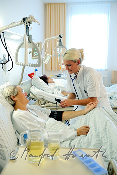 nurse measuring blood pressure