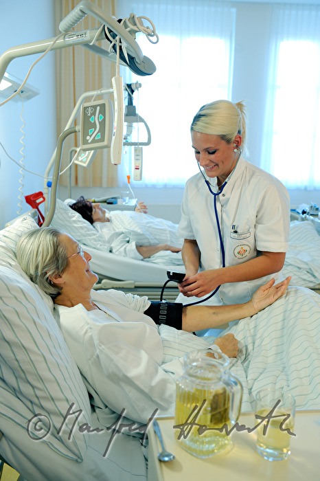 nurse measuring blood pressure