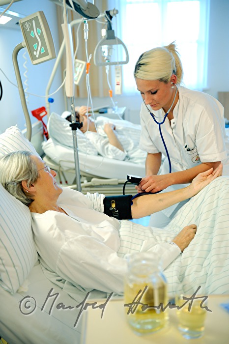 nurse measuring blood pressure
