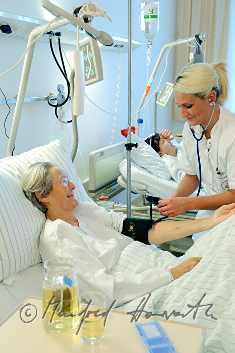nurse measuring blood pressure