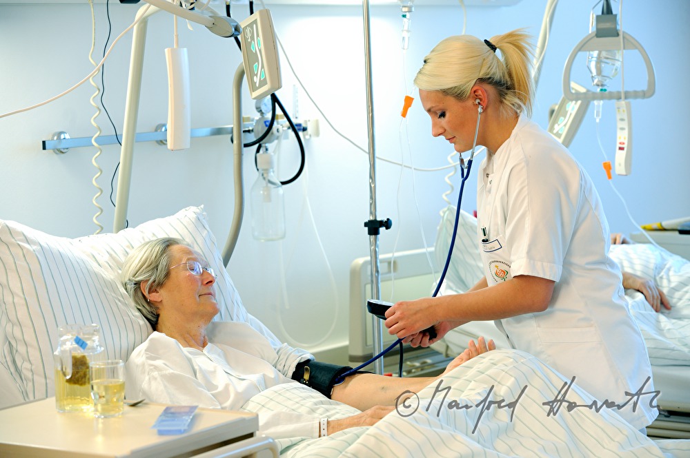 nurse measuring blood pressure