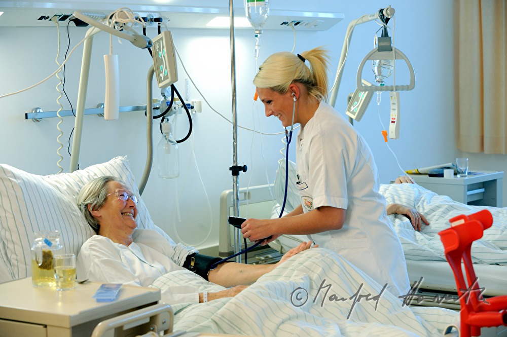 nurse measuring blood pressure