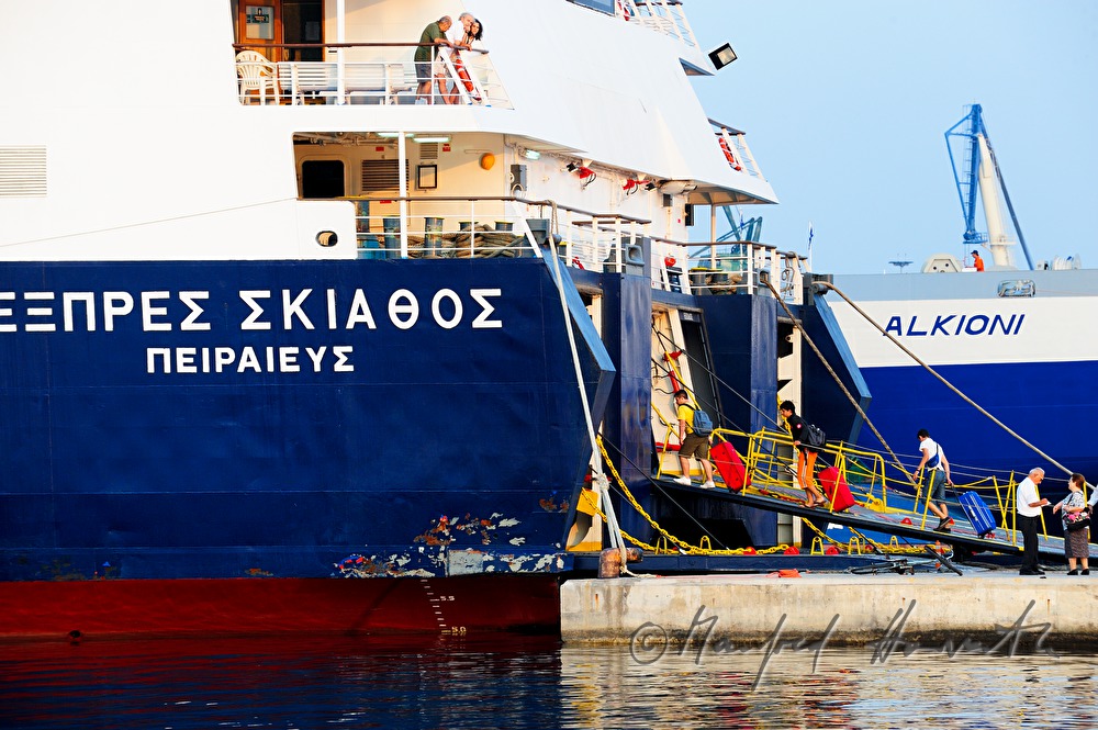 passengers entering a ferry ship