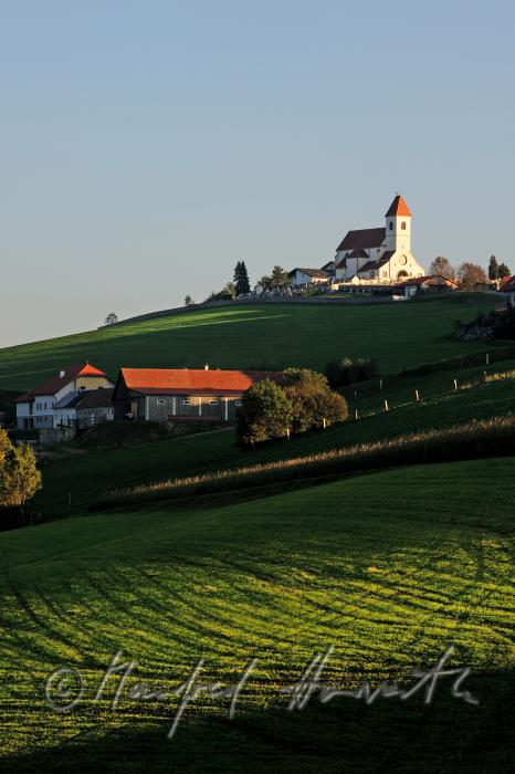 fortified church, farmhouse and pasture