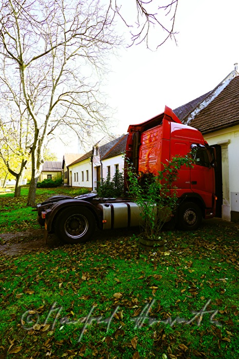 truck parks in front of a house