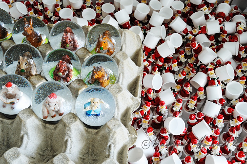 variety of snow globes and Santa Clauses