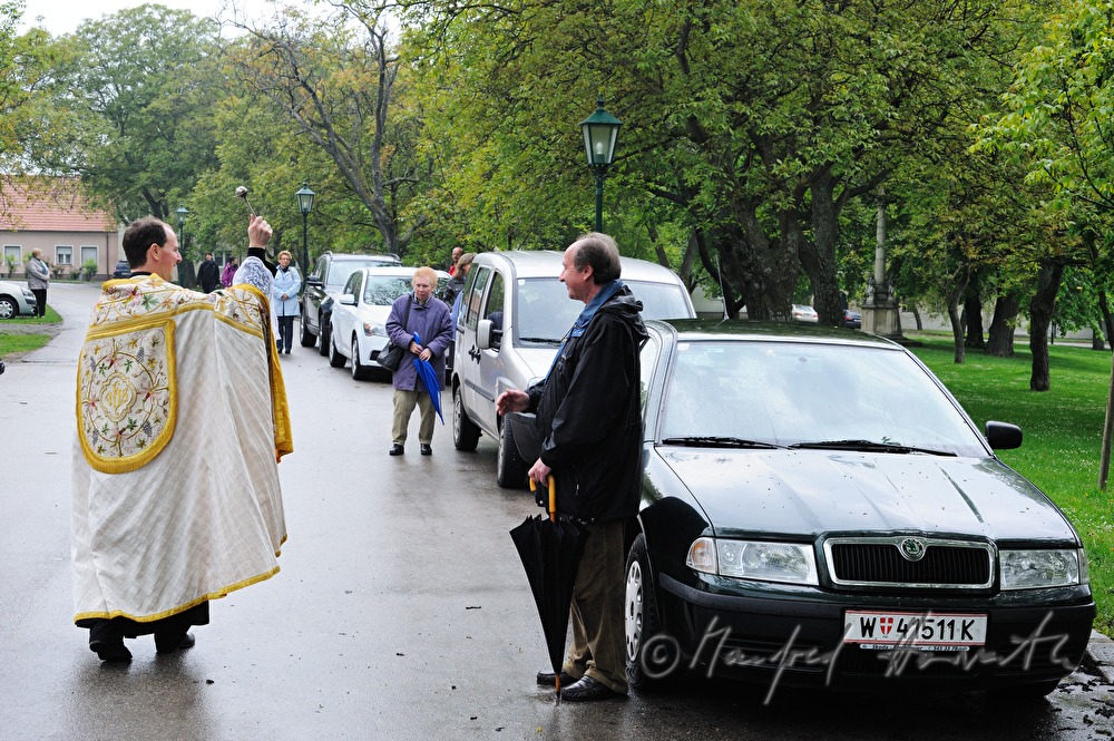 priest blessing cars near the Basilica