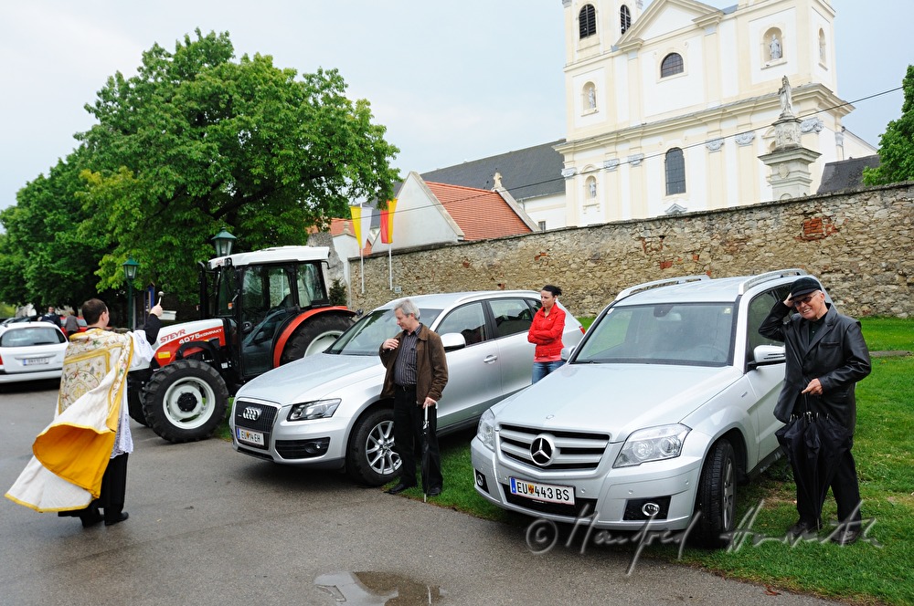 priest blessing cars near the Basilica