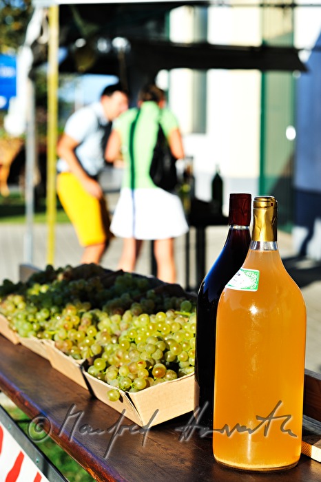 sidewalk sale offers grapes and must