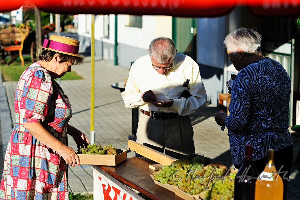 sidewalk sale offers grapes and must