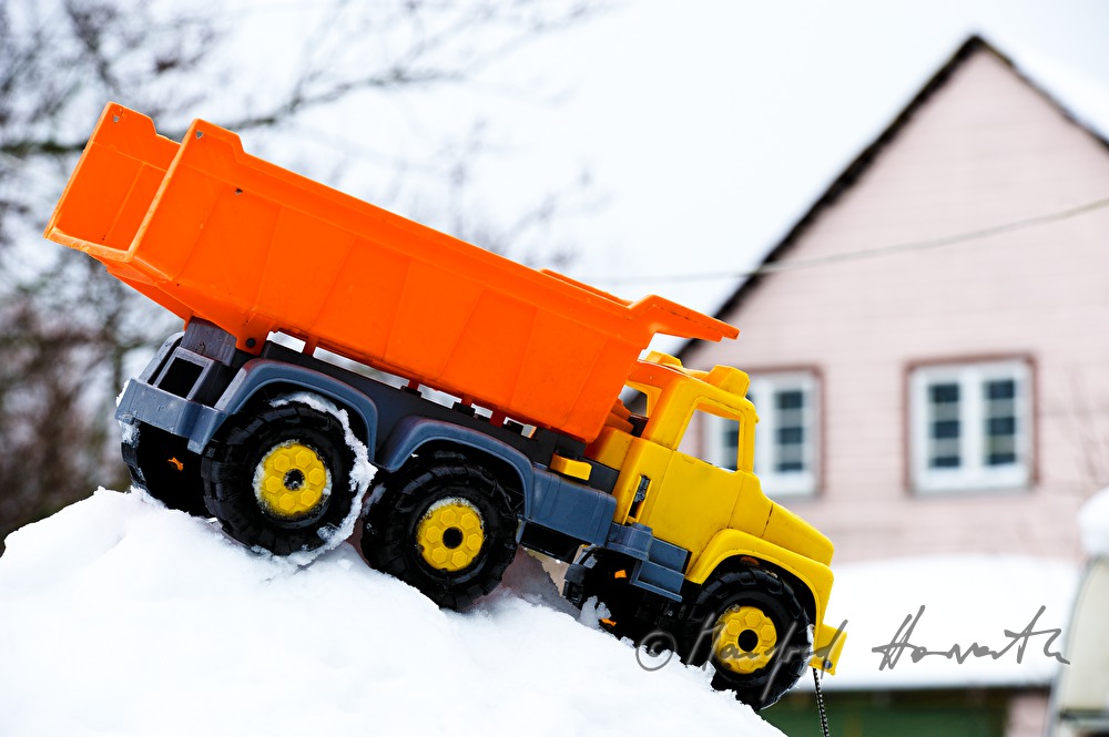 toy truck on a snow pile