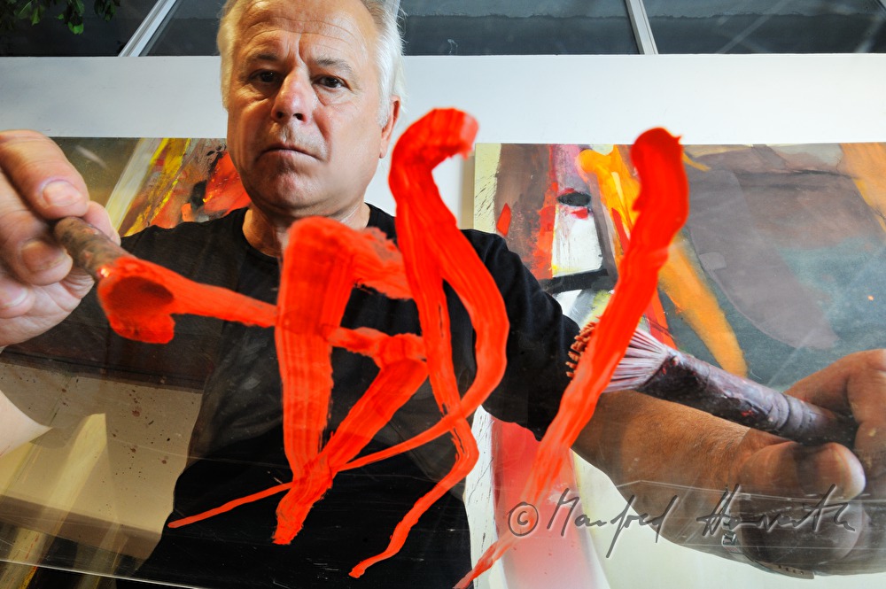 Sepp Laubner painting in his studio