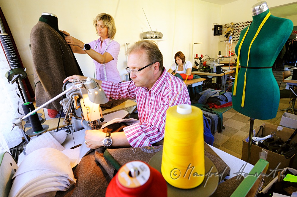 tailor in his workshop at 
