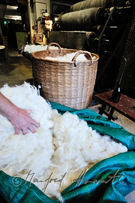 sheep's wool in wickerbaskets before carding