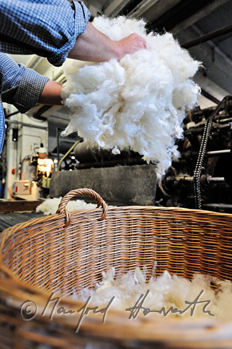 sheep's wool in wickerbaskets before carding