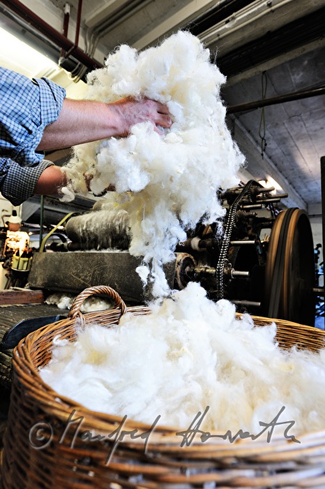 sheep's wool in wickerbaskets before carding