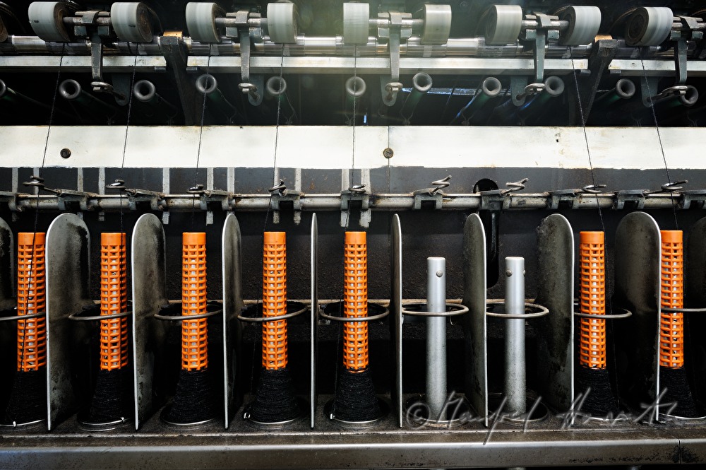 coils with thread on the winding machine