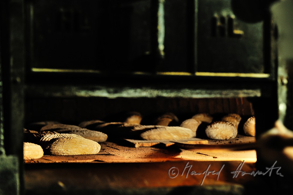 view into the baker's oven with breads inside