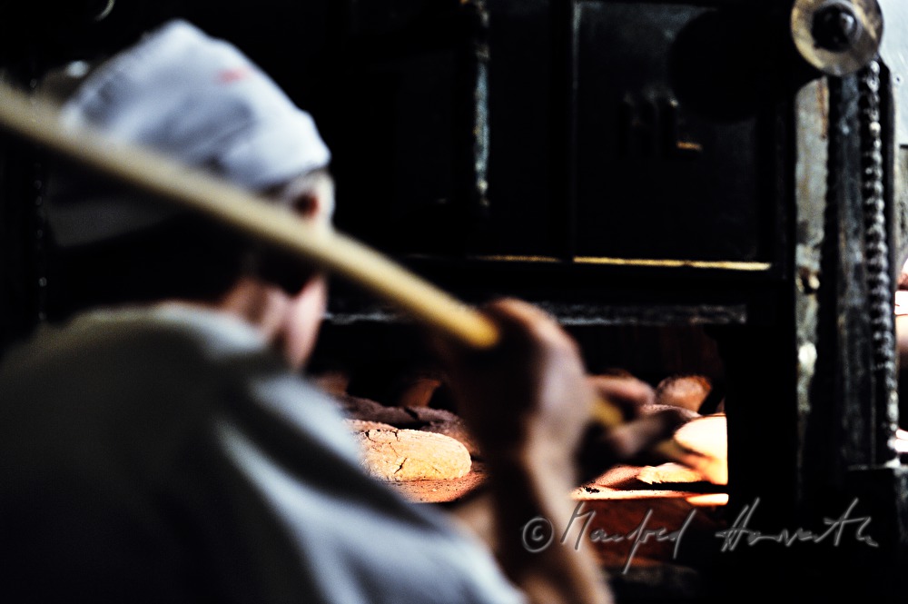 view into the baker's oven with breads inside