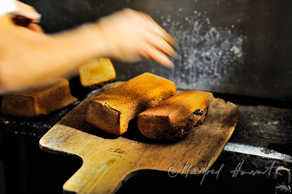 tin loafs coming out of the oven freshly