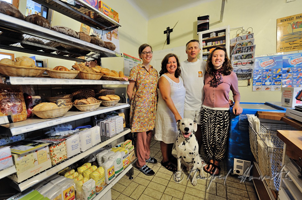 the family in the showroom of the grocery store