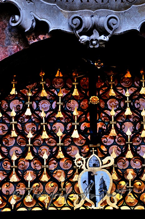 window with crown glass over the entrance to the church