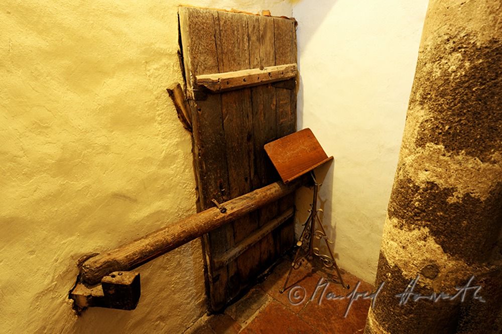 locked door to the choir stalls and a music stand