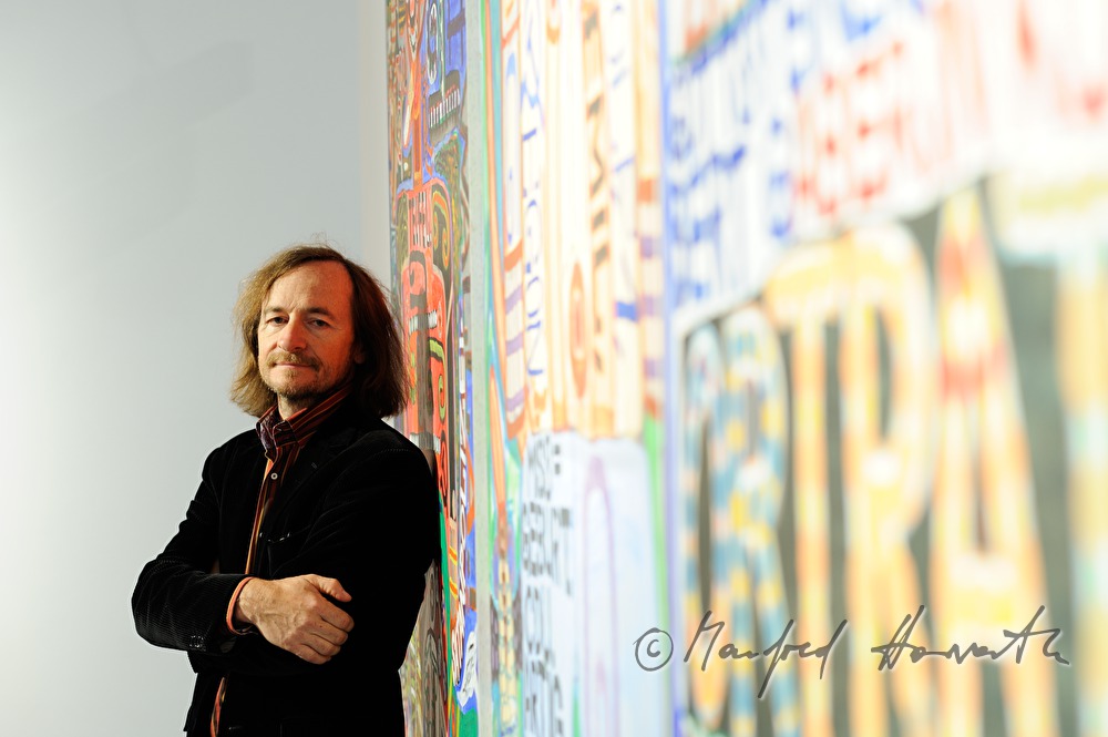 Director Johann Feilacher in an exhibition hall