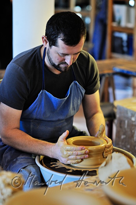 potter Joef Wieser kneading clay