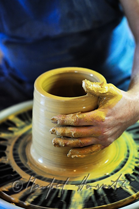 potter Joef Wieser working on the pottery wheel