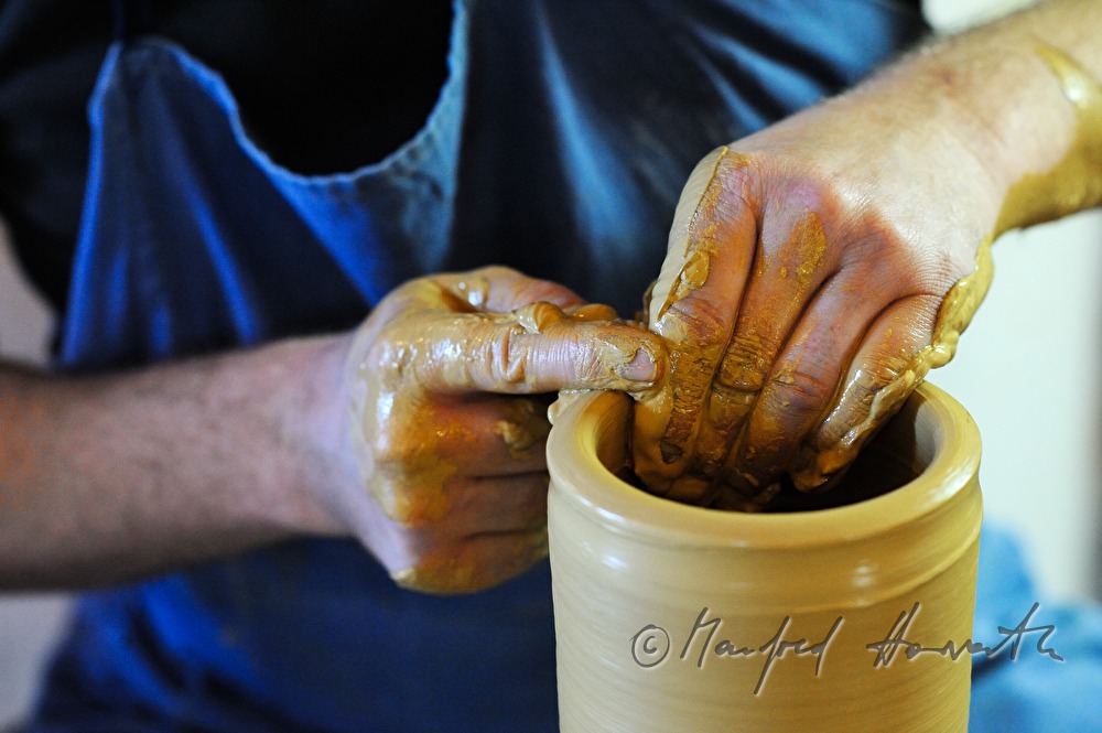 potter Joef Wieser working on the pottery wheel