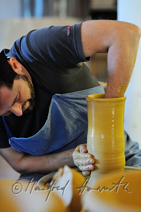 potter Joef Wieser working on the pottery wheel