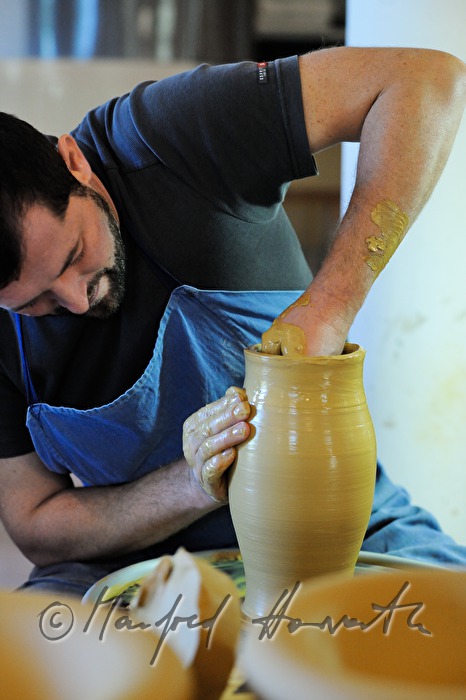potter Joef Wieser working on the pottery wheel