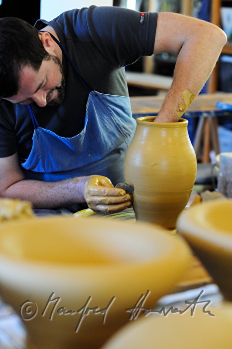 potter Joef Wieser working on the pottery wheel