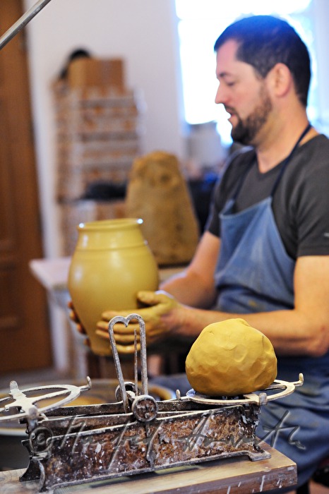 potter Joef Wieser working on the pottery wheel