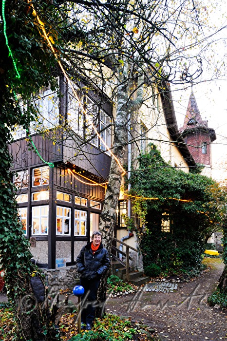 paintress Linde Waber in front of her house