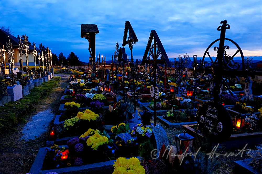 decorated graveyard near the church on All Hallows' Day