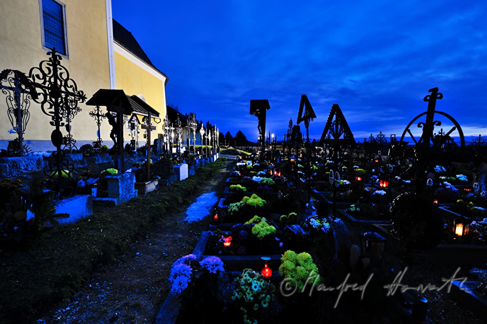 decorated graveyard near the church on All Hallows' Day