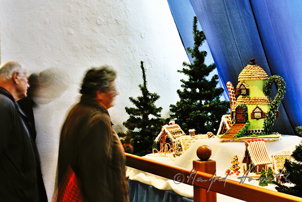 visitor in the gingerbread house exhibition
